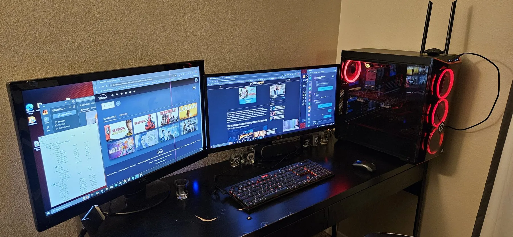 The rebuilt PC on the desk next to two monitors