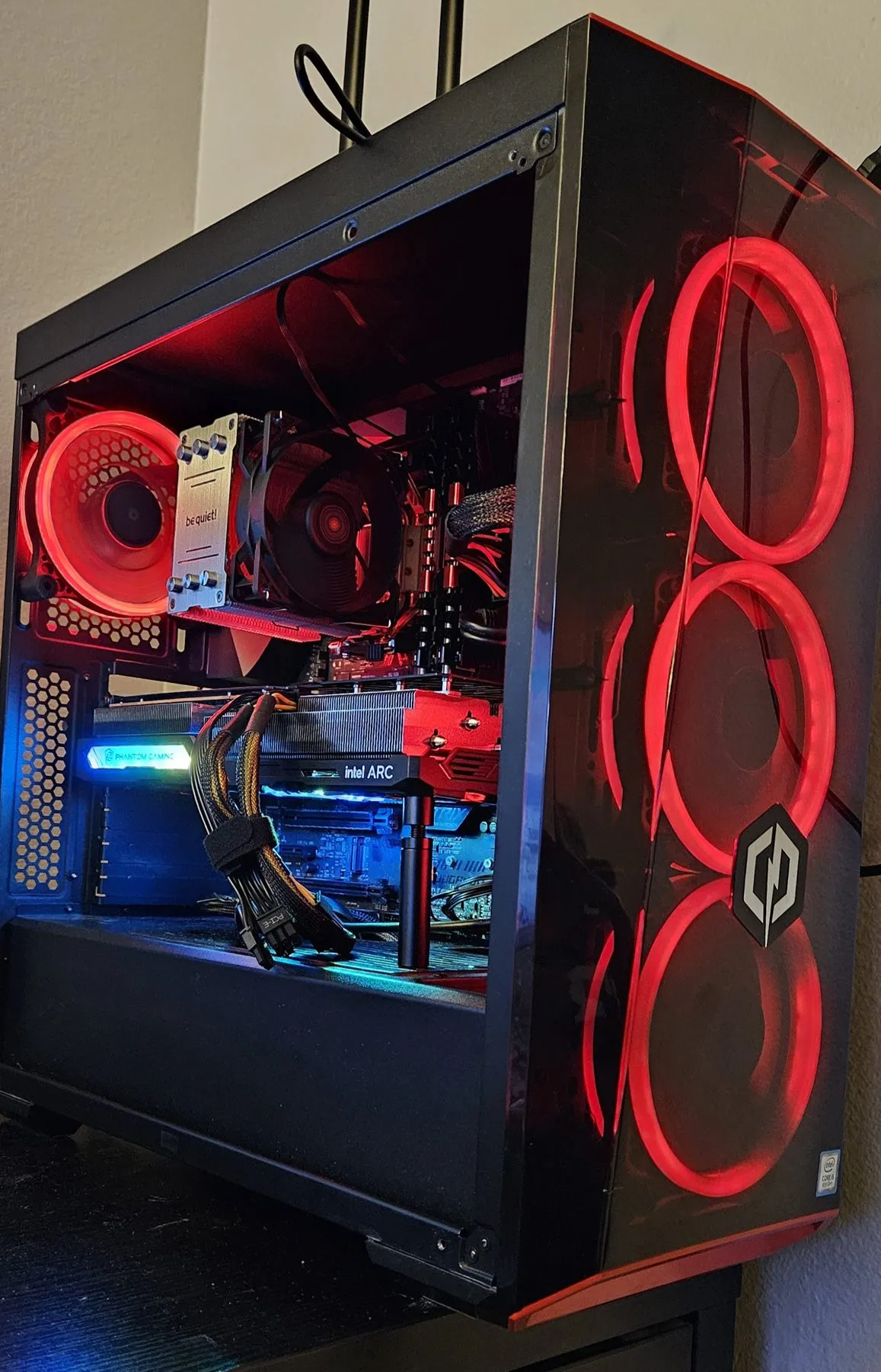 The PC glowing red with the Arc A770 installed